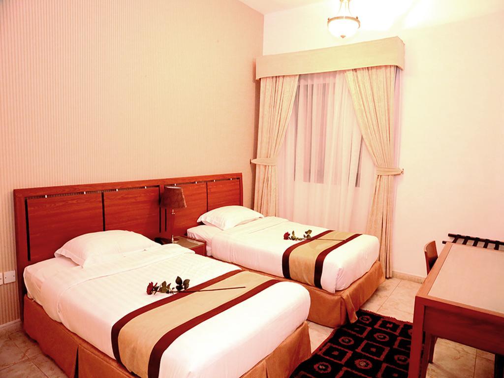 Arcadia Hotel Suites Sharjah Kamer foto